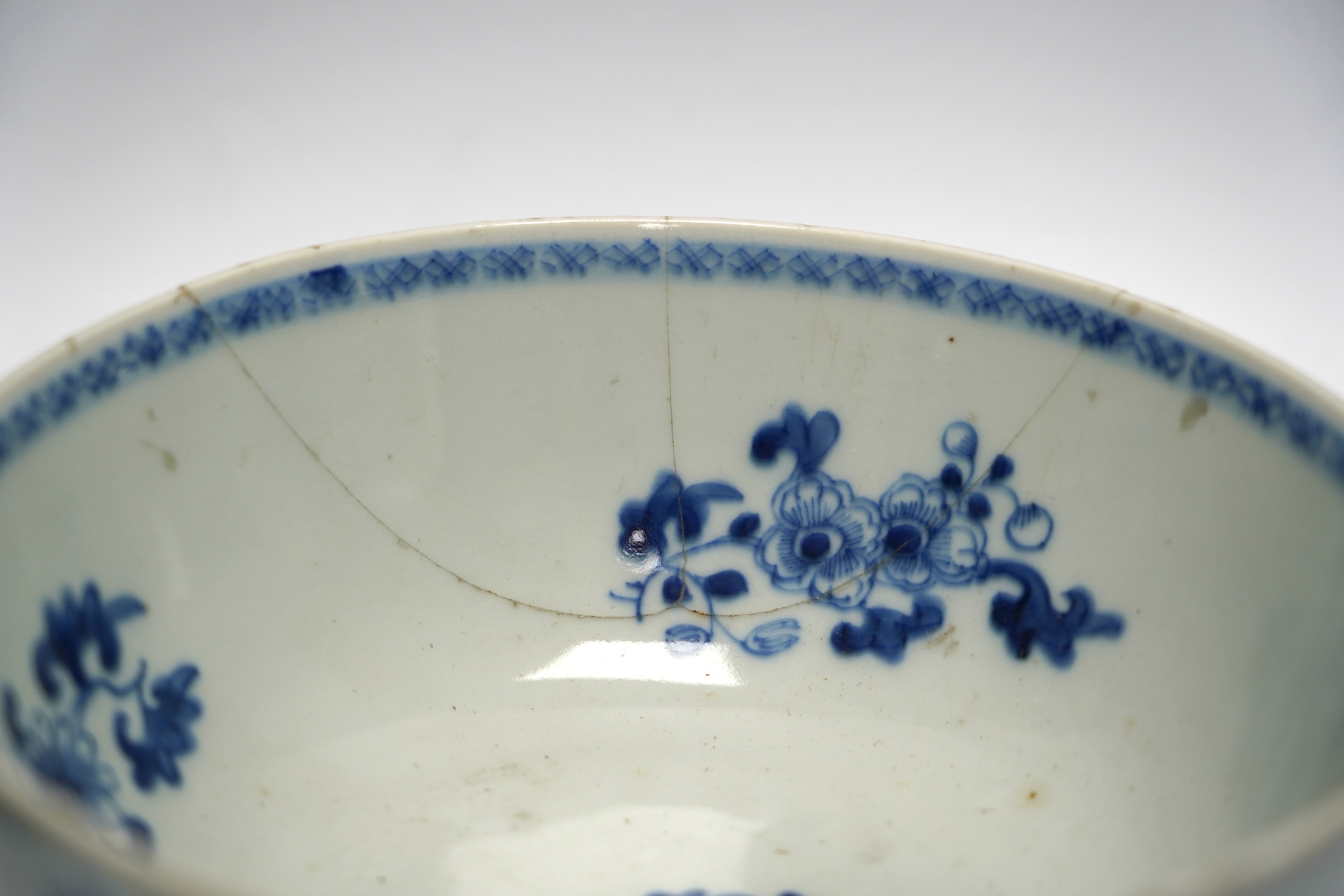 A group of 18th century Chinese and Japanese porcelain including blue and white bowls and jar with hardwood cover, largest 19cm in diameter